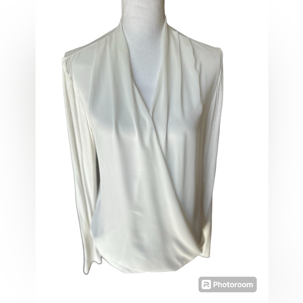 Double Zero cream colored soft multi fabric long sleeve front snap blouse. LGE